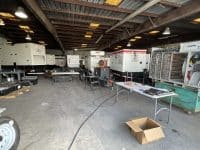 MegaWattage Warehouse Stocked With Portable Commercial Generators At Multiple Different Power Capacities.