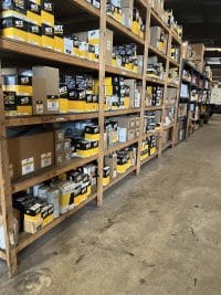 MegaWattage Shop Walls Lined With Shelves Of Parts And Tools.