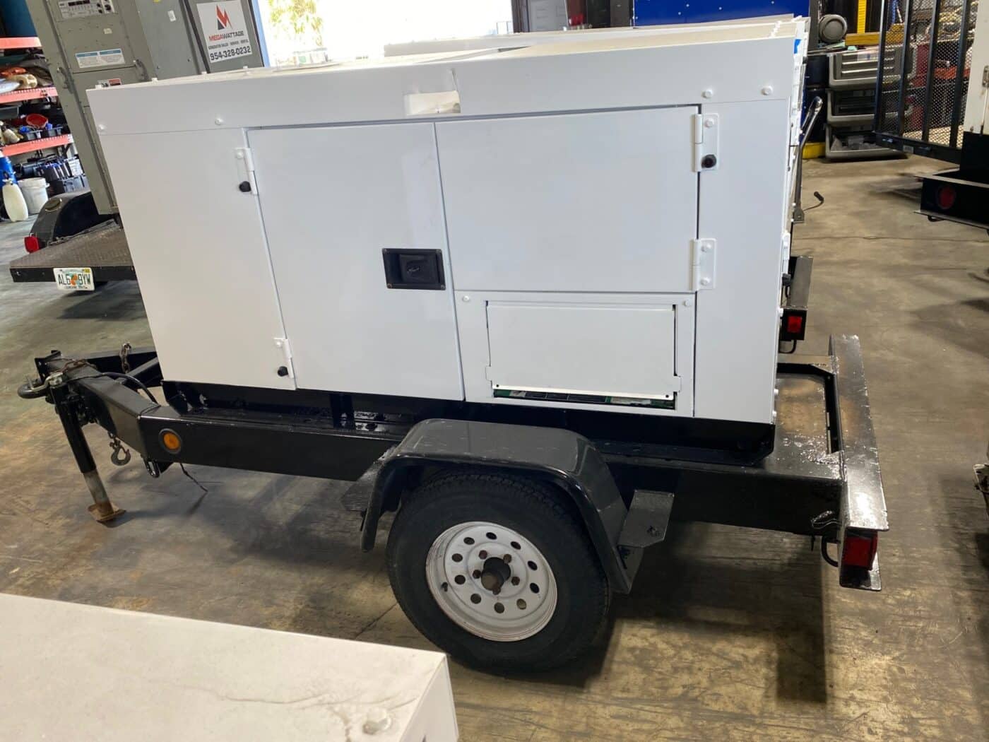 External View Of A Trailer-Mounted 20kW MultiQuip WhisperWatt Generator.