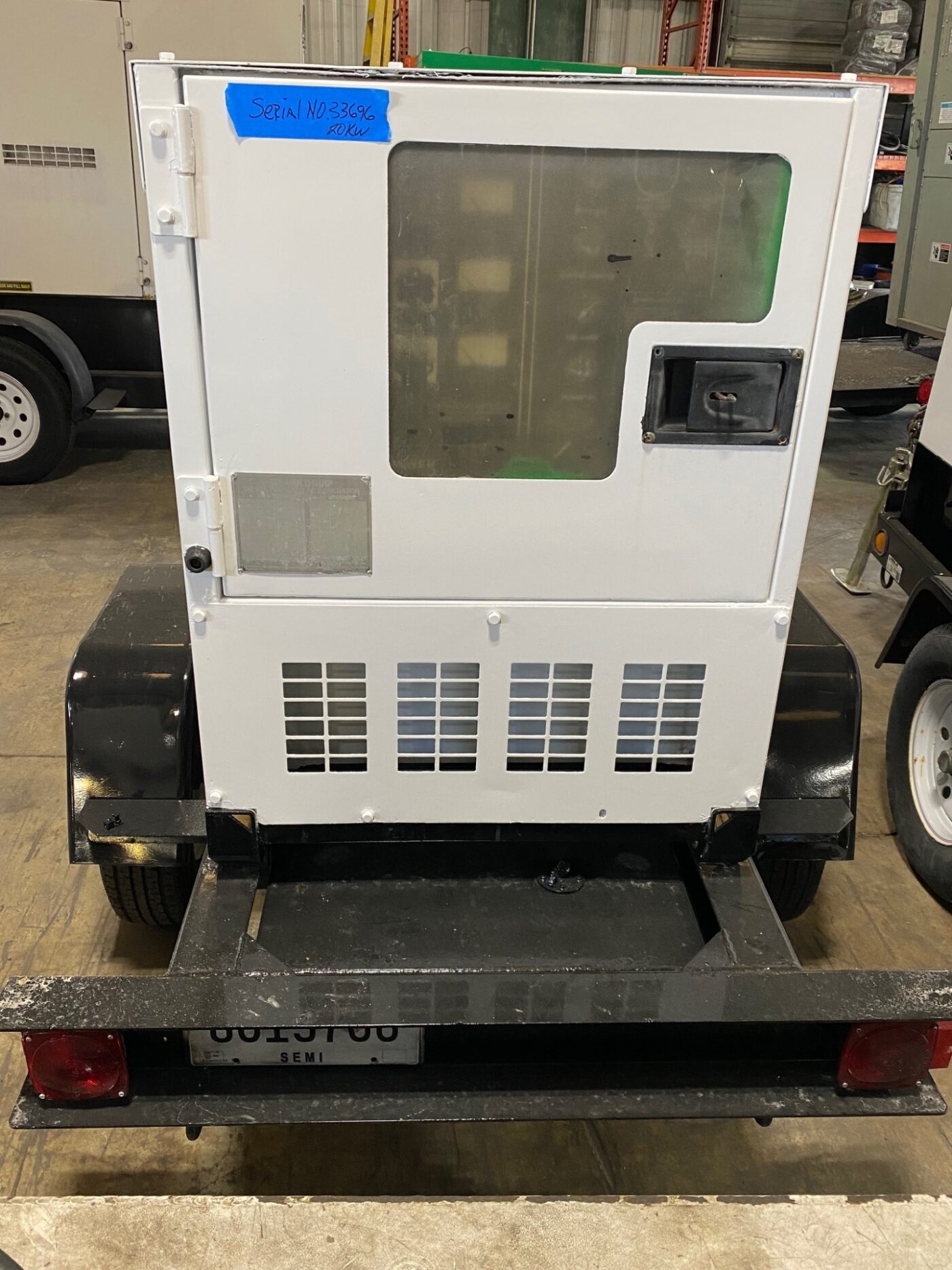 External View Of A Trailer-Mounted 20kW MultiQuip WhisperWatt Generator.