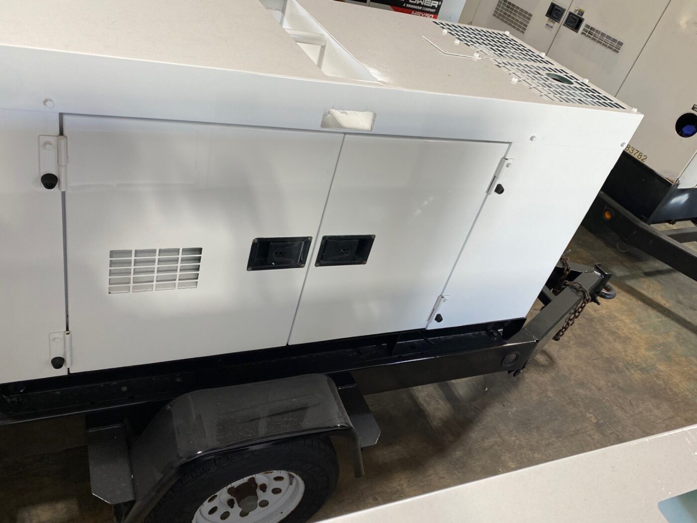 Top View Of A Trailer-Mounted 20kW MultiQuip WhisperWatt Generator.